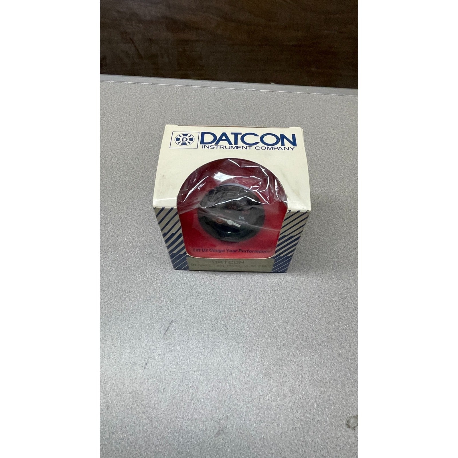 DATCON EM Gauge, 881 Press, 0-80 PSI, Oil Pressure Gauge, Part No. 06340-01 top of box displaying gauge