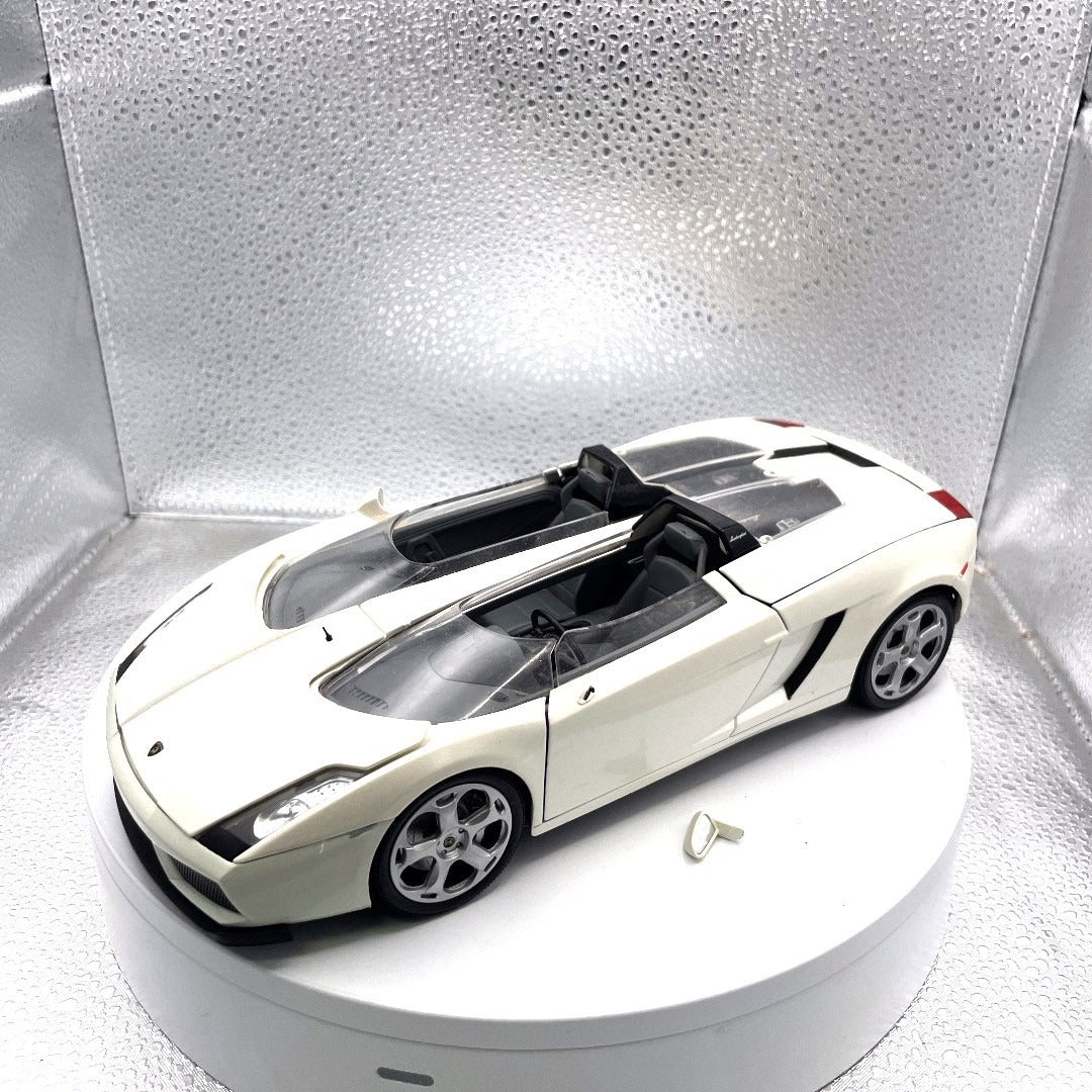 Motormax Lamborghini Concept S White Die Cast, Scale: 1/18, No. 79156 drivers side view with mirror broken off included with car shown by drivers door