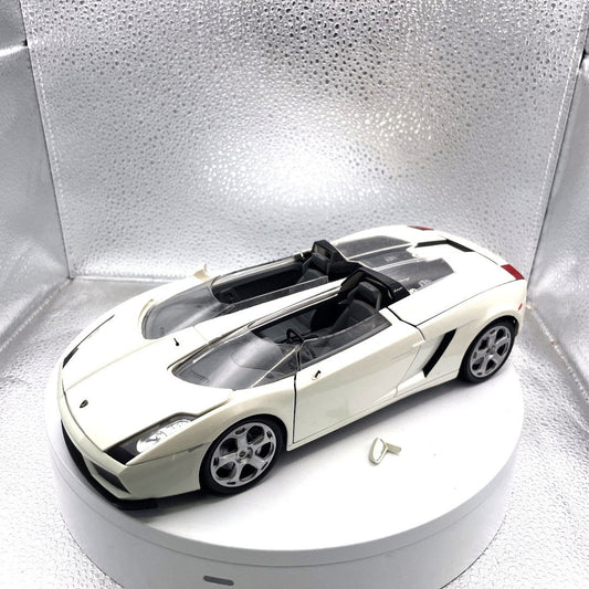 Motormax Lamborghini Concept S White Die Cast, Scale: 1/18, No. 79156 drivers side view with mirror broken off included with car shown by drivers door