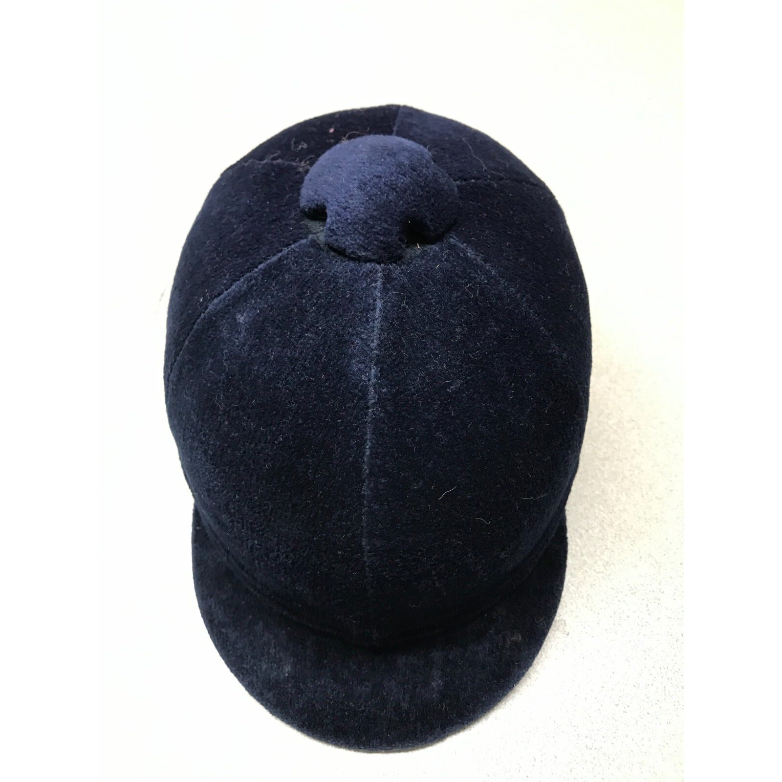 Navy blue velvet equestrian helmet size 6 7/8ths top view of helmet