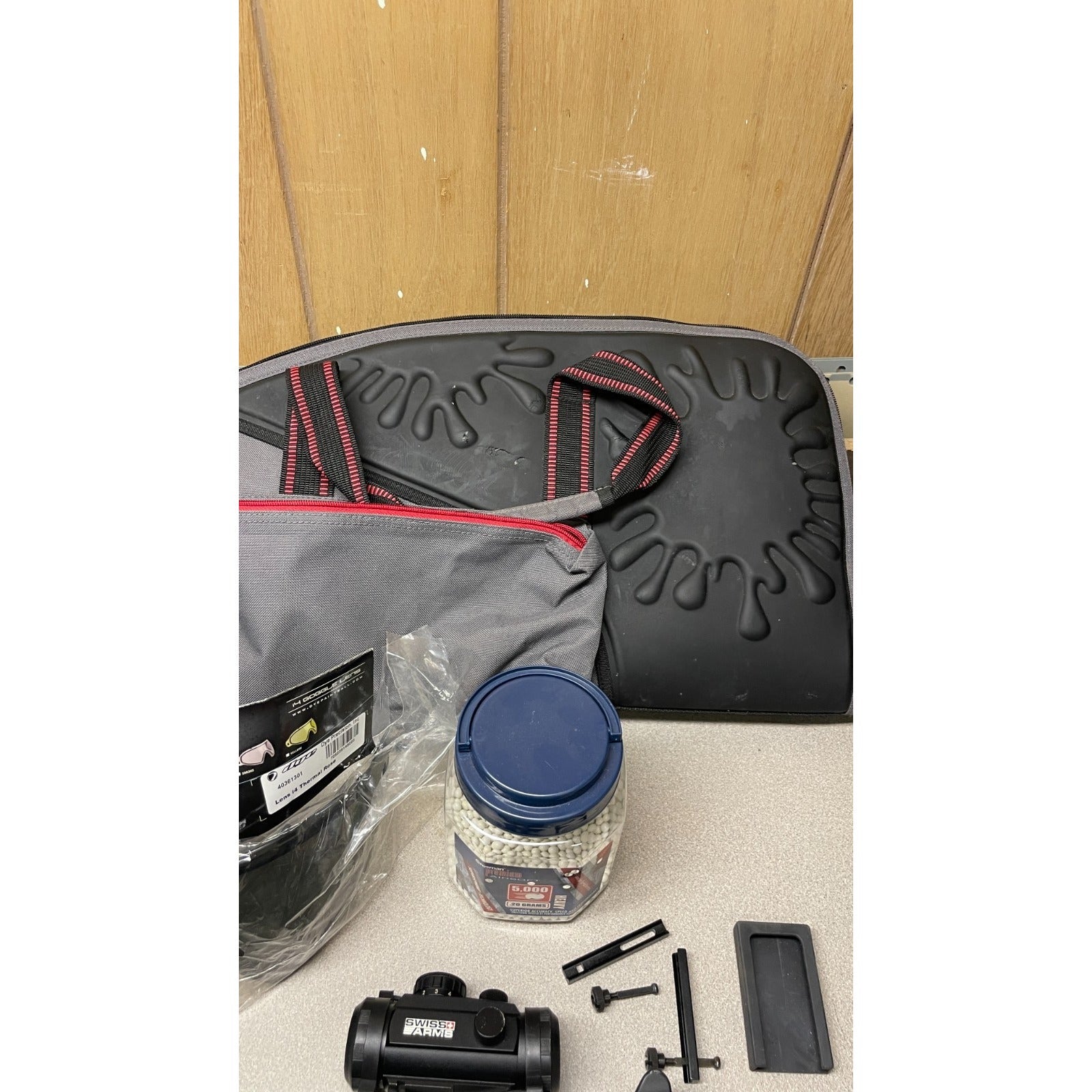 DPMS Panther Arms U050810381 M4 Style Airsoft Gun Lot UNTESTED, Accessories and Bag Included. Swiss Arms Sight, DYE i4 Goggle Lens, Crosman .20 Grams Airsoft closeup of carrying case, accessories