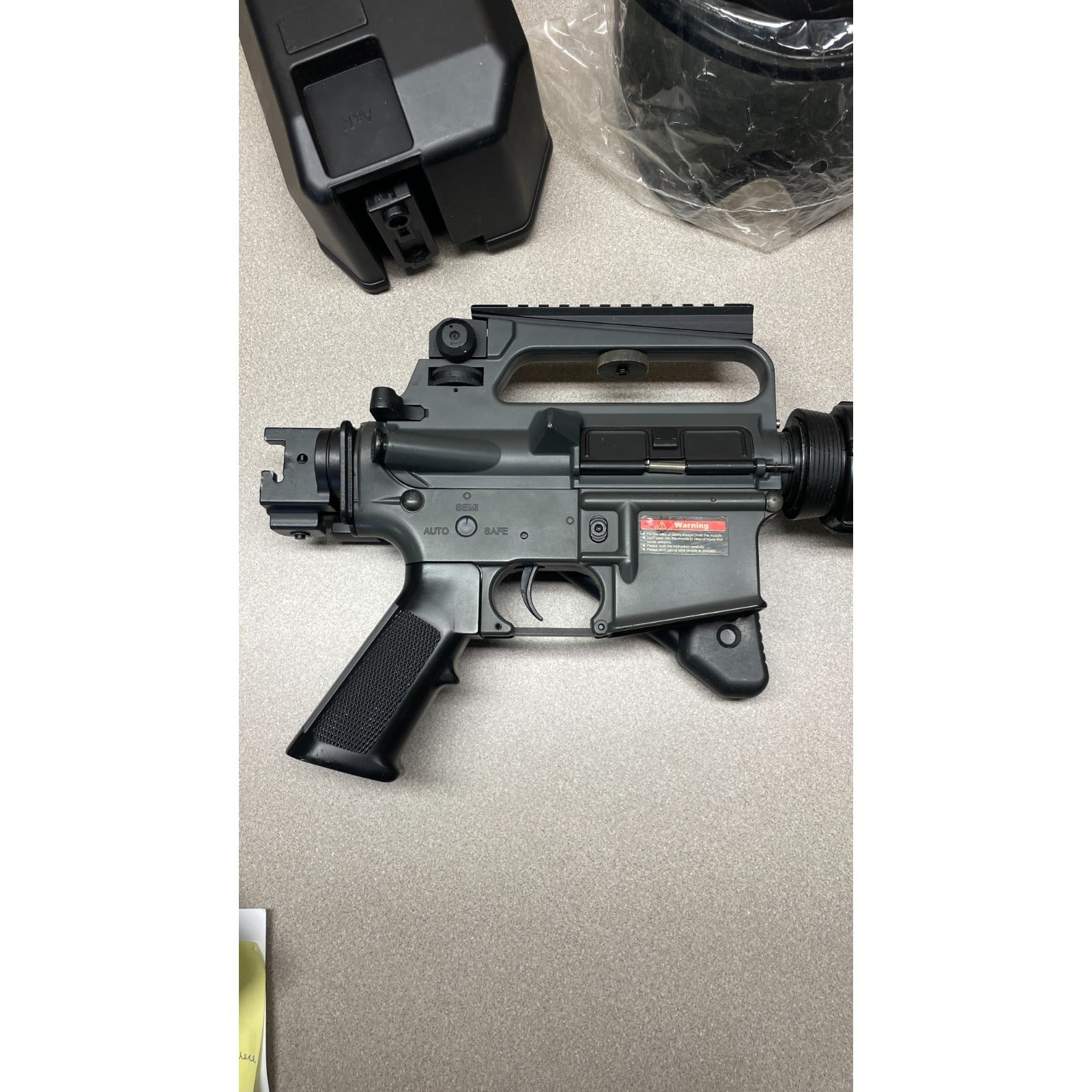 DPMS Panther Arms U050810381 M4 Style Airsoft Gun Lot UNTESTED, Accessories and Bag Included. Swiss Arms Sight, DYE i4 Goggle Lens, Crosman .20 Grams Airsoft closeup of gun