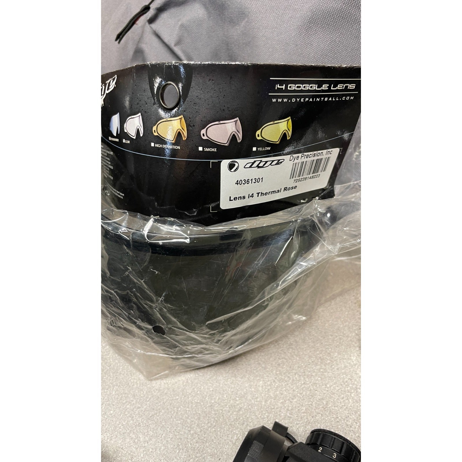 DPMS Panther Arms U050810381 M4 Style Airsoft Gun Lot UNTESTED, Accessories and Bag Included. Swiss Arms Sight, DYE i4 Goggle Lens, Crosman .20 Grams Airsoft closeup of goggle lens