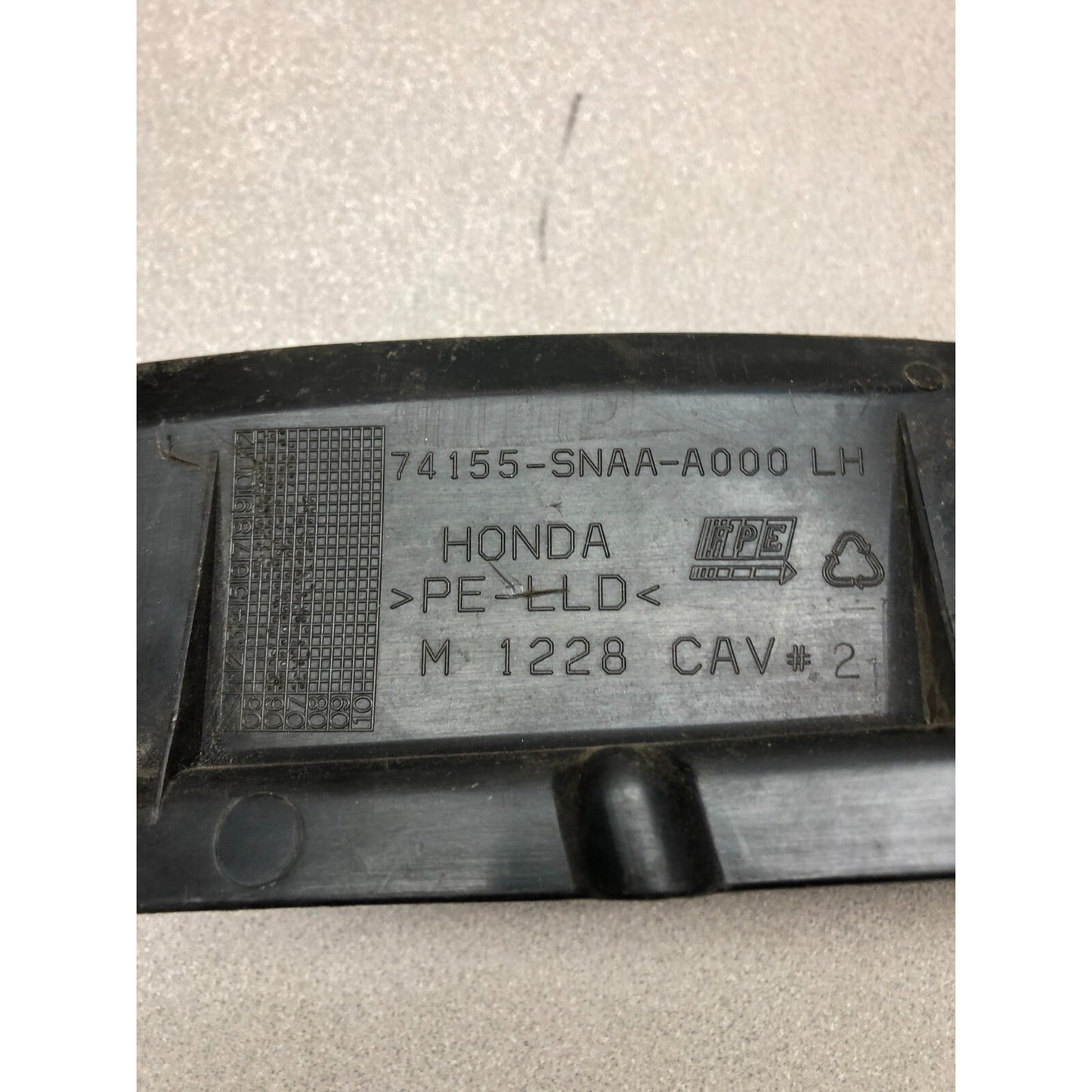 Honda Fender 74155-SNAA-A000 LH product stamp closeup