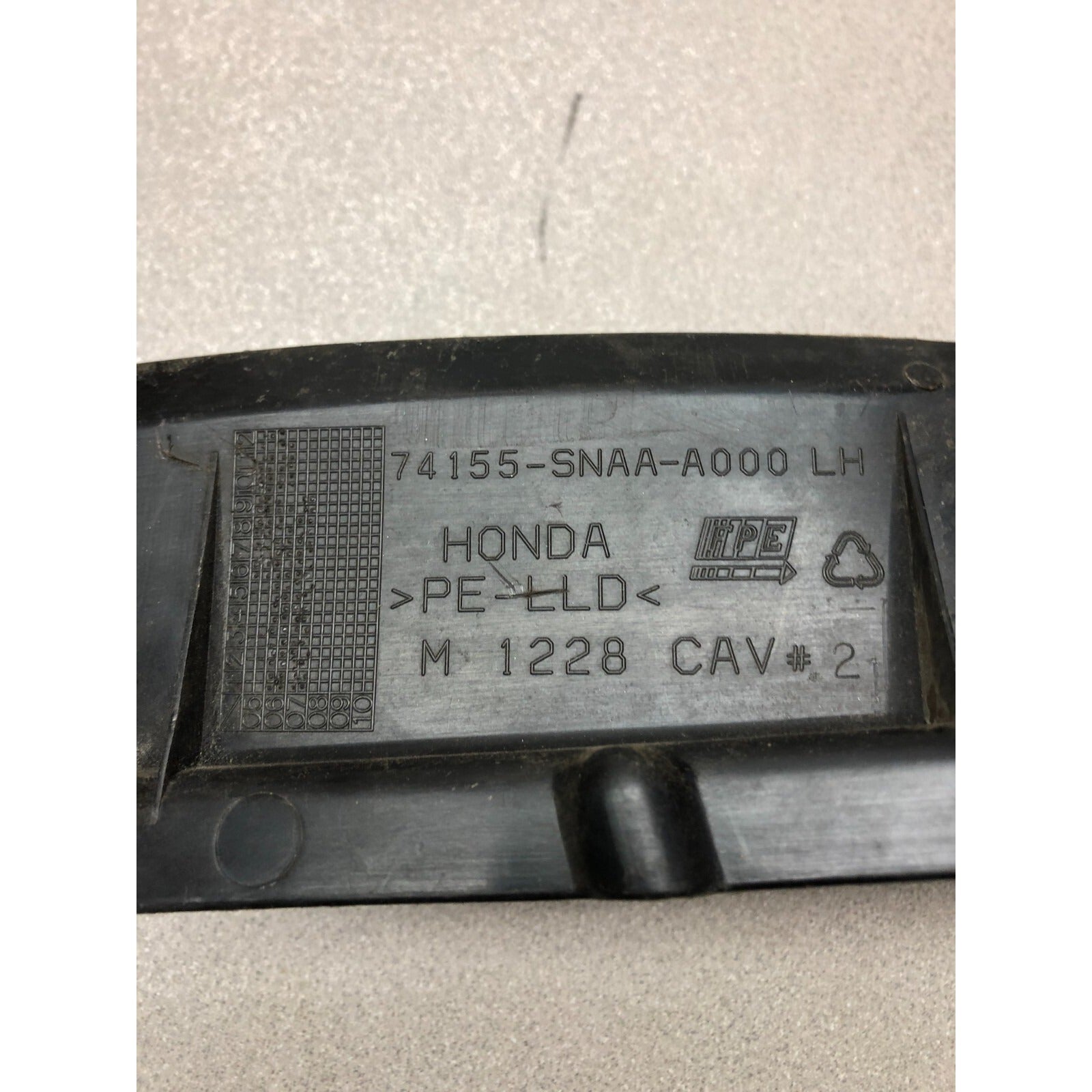 Honda Fender 74155-SNAA-A000 LH product stamp closeup