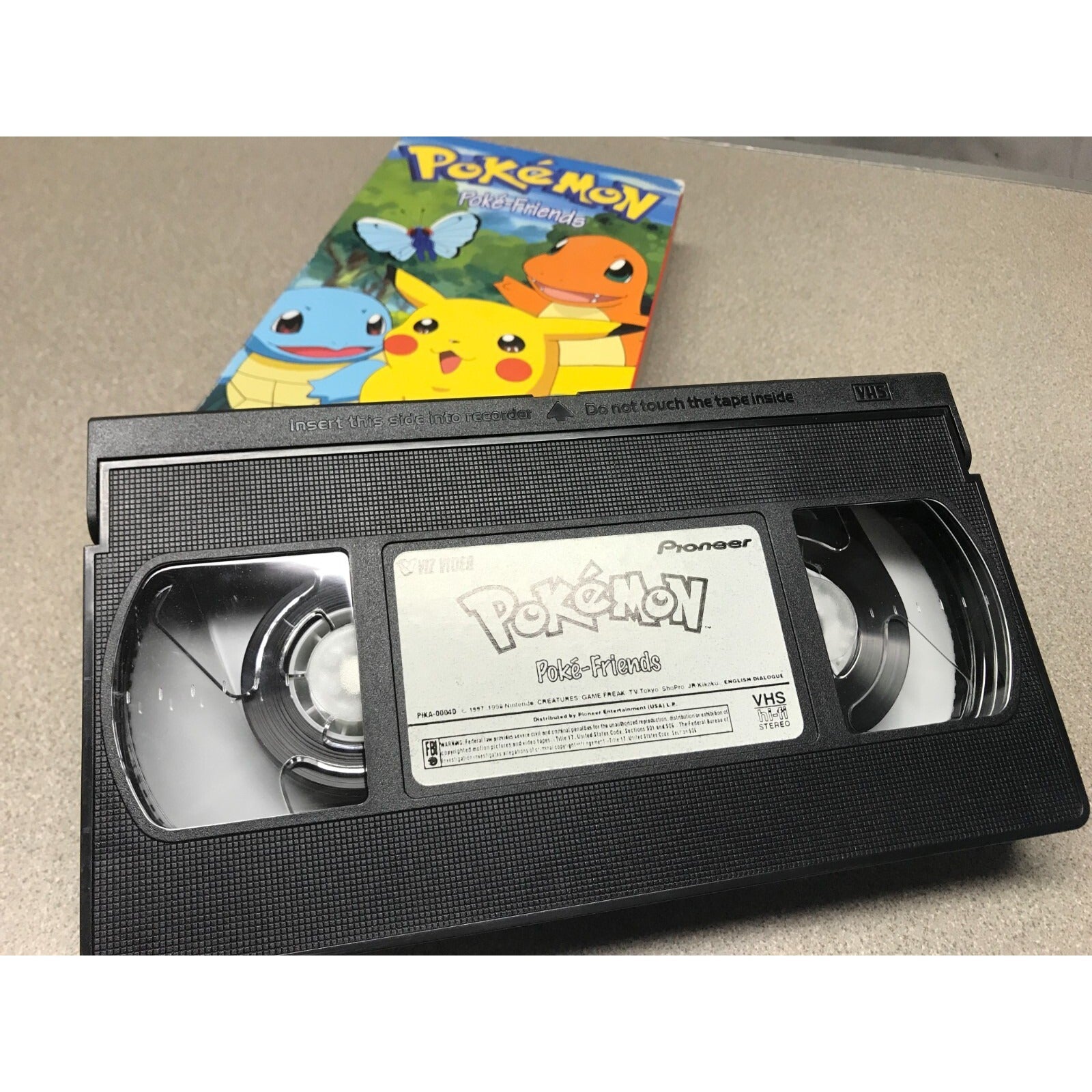 Pokemon VHS Set Includes: Poke-Friends, Thunder Shock, The Great Race, Fashion Victims, Seaside Pikachu, Pikachu Party cassette closeup