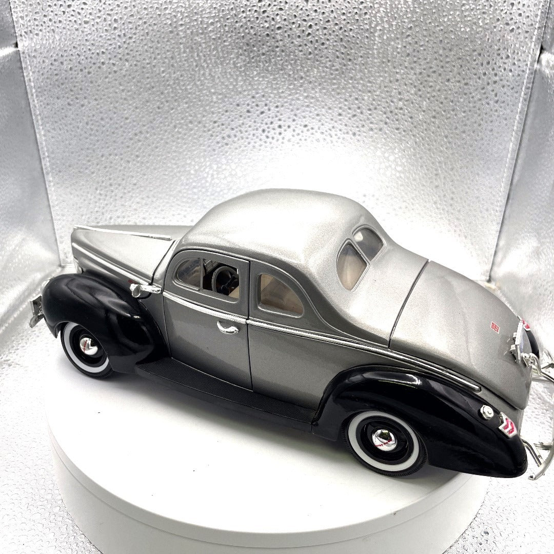 Motor Max 1940 Ford Sedan Silver/Black Die Cast, Scale: 1/18, No. 73108 drivers side/back end view