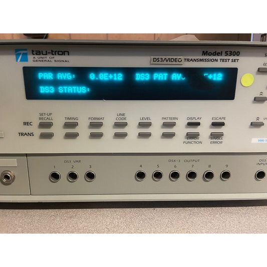 A Tau-tron Model 5300 video transmission test set with a digital display and various control buttons and ports.