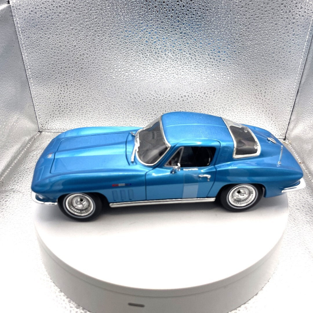 Maisto 1965 Chevrolet Corvette Light Blue Die Cast, Scale: 1/18 driver's side view
