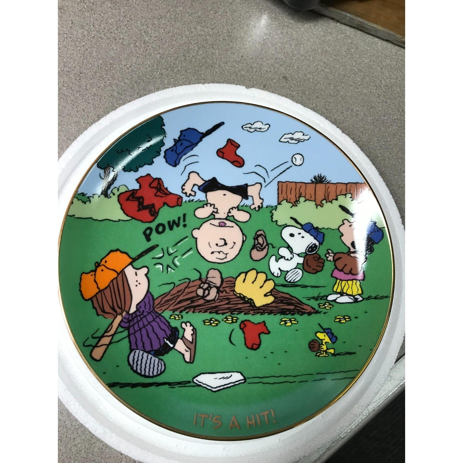 The Danbury Mint Peanuts Magical Moments Plates "It's a Hit!" Serial No. A4119 front of plate 