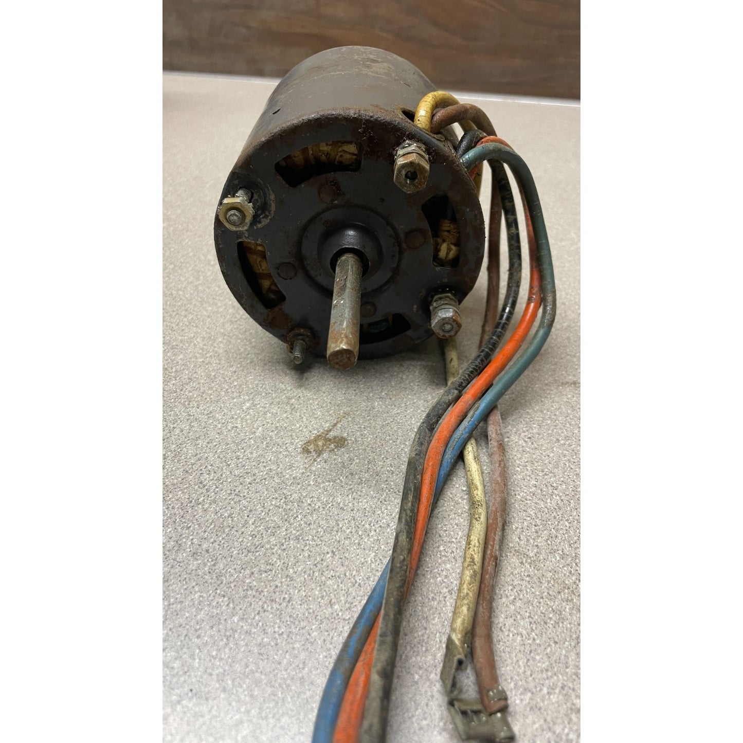 Small electric motor with wires on a textured surface