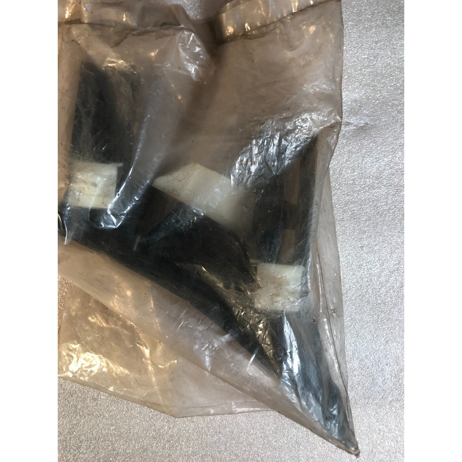 Honda 71595-SM4-000 Slide L, RR Bumper closeup of bumper in package