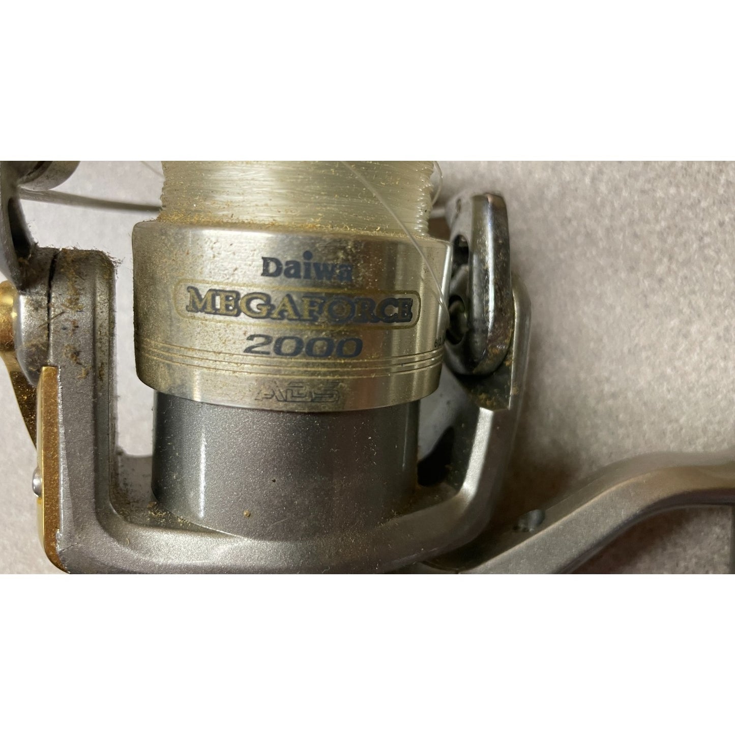 Daiwa Megaforce 2000 Spinning Reel closeup of logo and model number