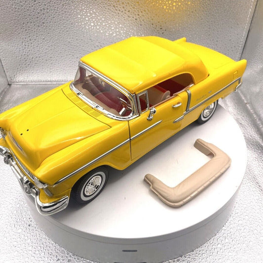 Motormax 1955 Chevrolet Bel Air Yellow Convertible Die Cast, 1/18 Scale, No. 73184 front and driver's side view
