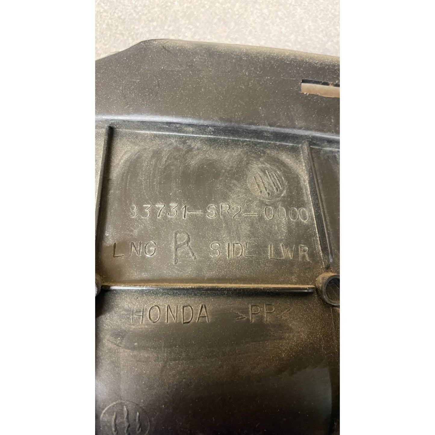 OEM Honda Civic Del Sol Driver Lower Right Rear Interior Cover Trim Panel OEM closeup of product information stamp on back of part