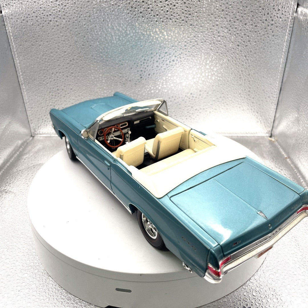 Maisto 1965 Pontiac GTO Convertible Light Blue Die Cast, Scale: 1/18, Special Edition drivers side/back end view