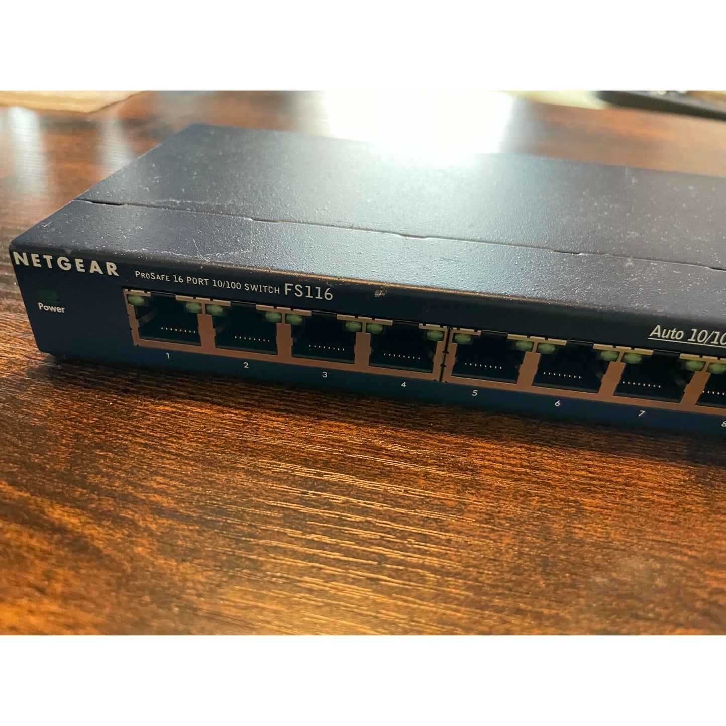Netgear ProSafe 16 Port 10/100 Switch Model FS116 back panel with 16 ports closeup