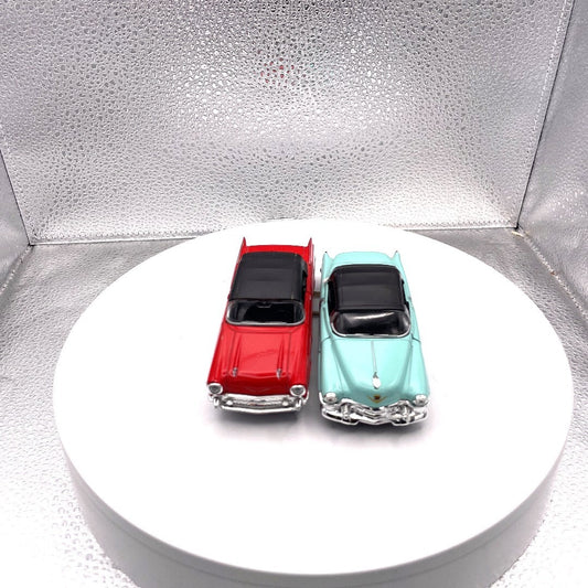 Welly Wind Up Car Lot of 2, 1857 Chevrolet Bel Air Red, 1953 Cadillac Eldorado Teal front end view