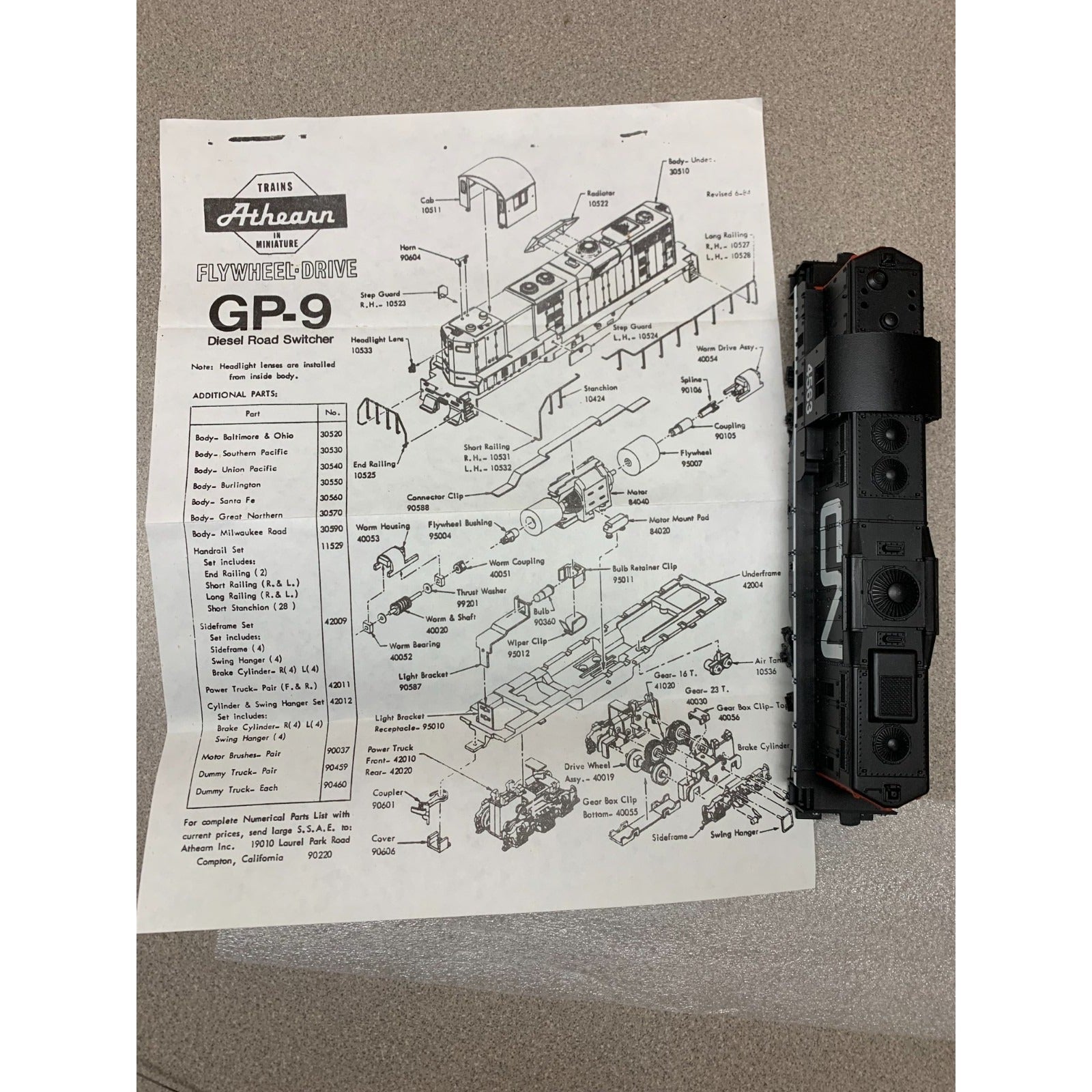 Athearn #4563 Canadian National Train Diesel Road Switcher GP-9 Power full view of parts diagram with train car to the side