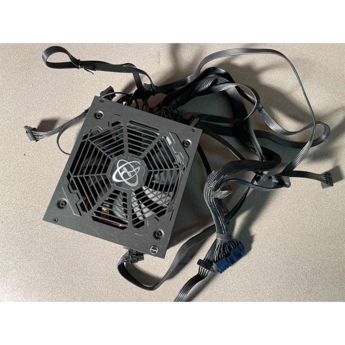 XFX XTR 550 Power Supply Model XPS-550W-BEF top view with cables