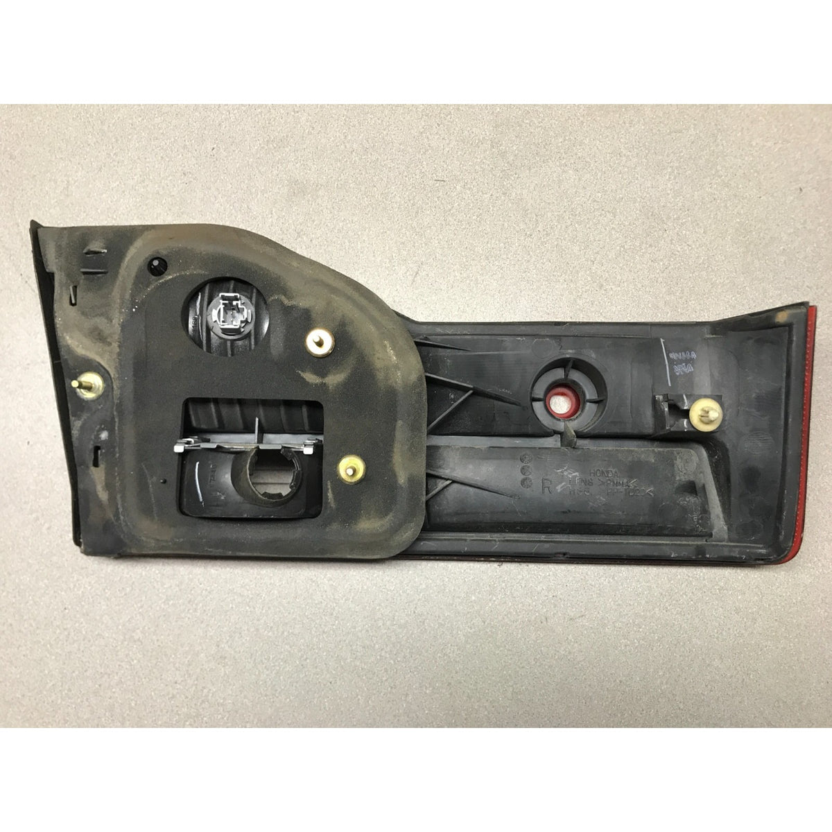 A used automotive tail light assembly housing, showing the internal components, screws, and lens cutouts, photographed on a neutral light gray background. 2001-2002 Honda Accord Sedan OEM Tail Lights - Full Set back view