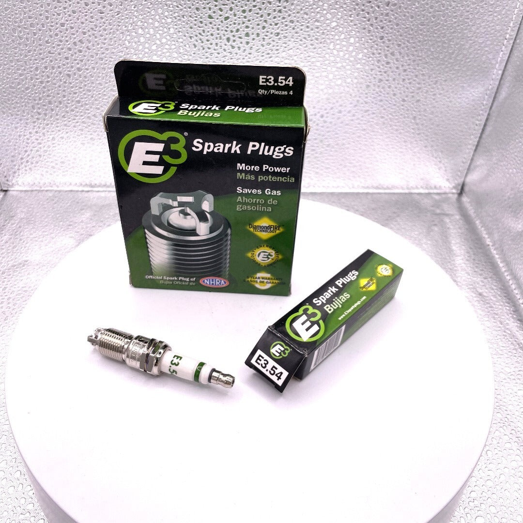 E3 Spark Plugs packaging and spark plugs on a white background