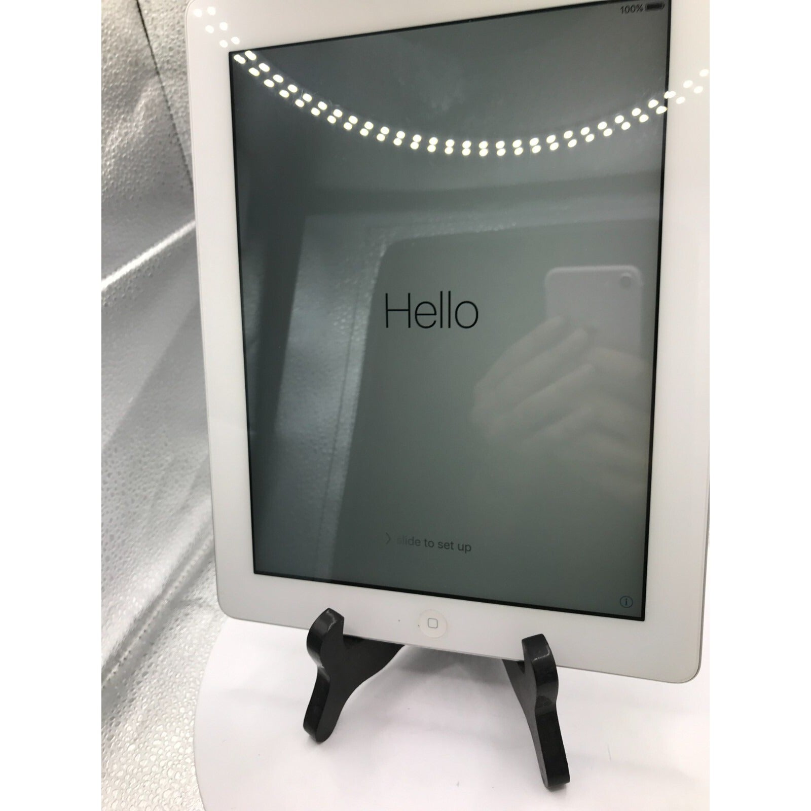 Used iPad 2 Model A1395 16GB with charging cable front view powered on