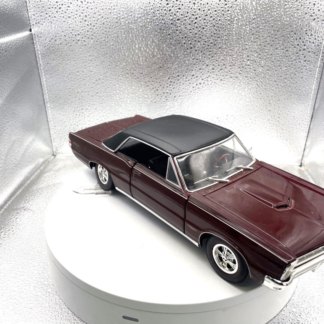 Maisto 1965 Pontiac GTO Special Edition Maroon Die Cast, Scale: 1/18 passenger side/front end view