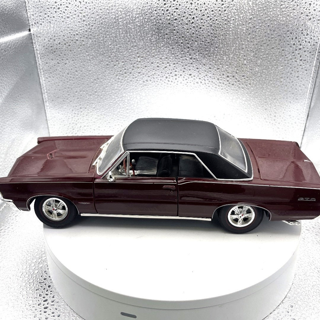 Maisto 1965 Pontiac GTO Special Edition Maroon Die Cast, Scale: 1/18 drivers side view