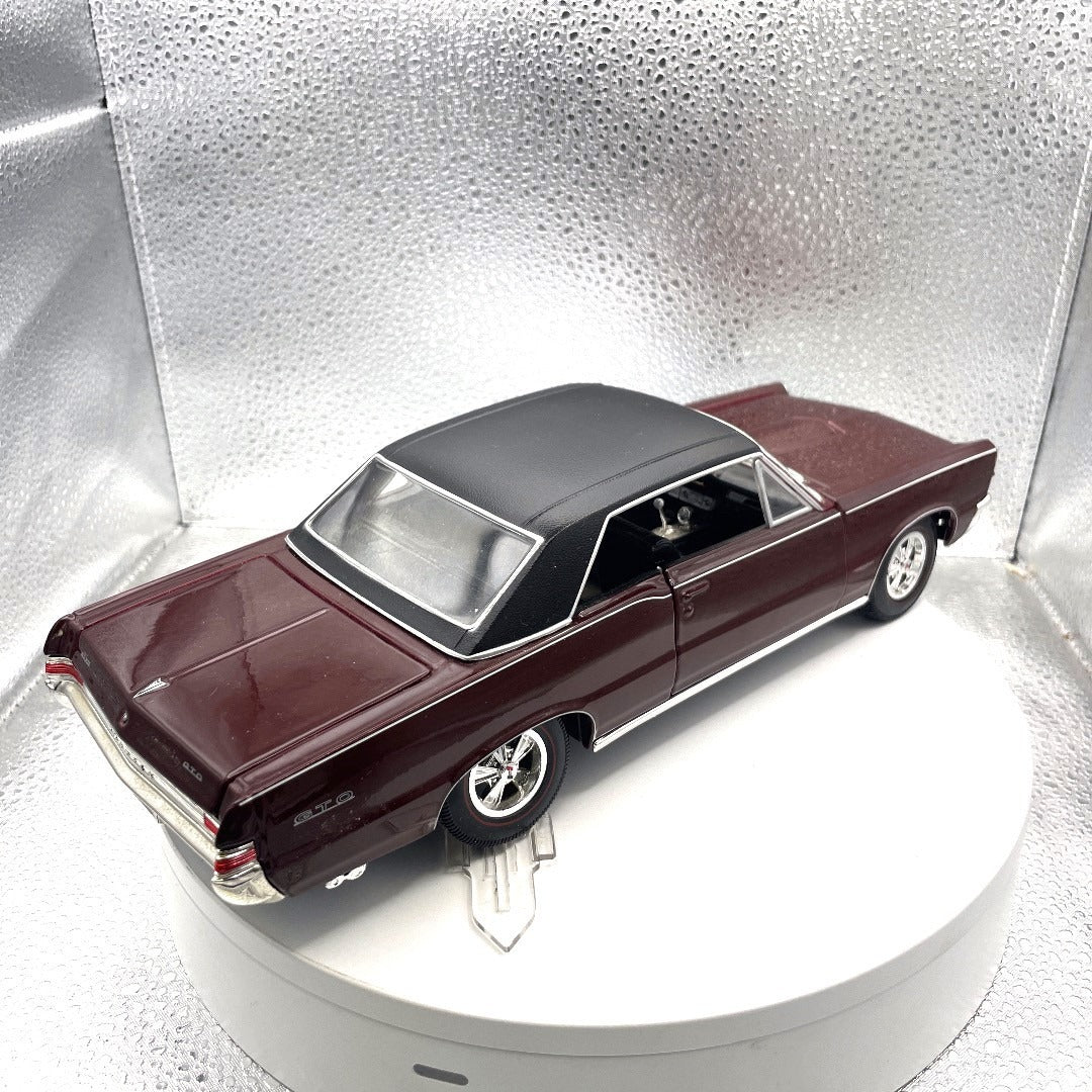Maisto 1965 Pontiac GTO Special Edition Maroon Die Cast, Scale: 1/18 back end/passenger side view