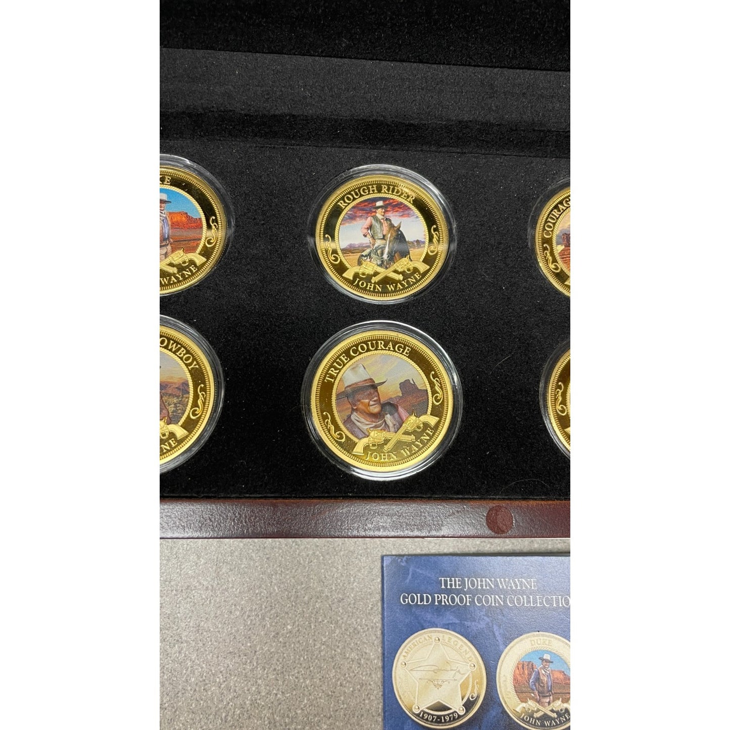 Bradford Exchange John Wayne Commemorative Coins and Collection Case closeup of coins in case rough riders, true courage