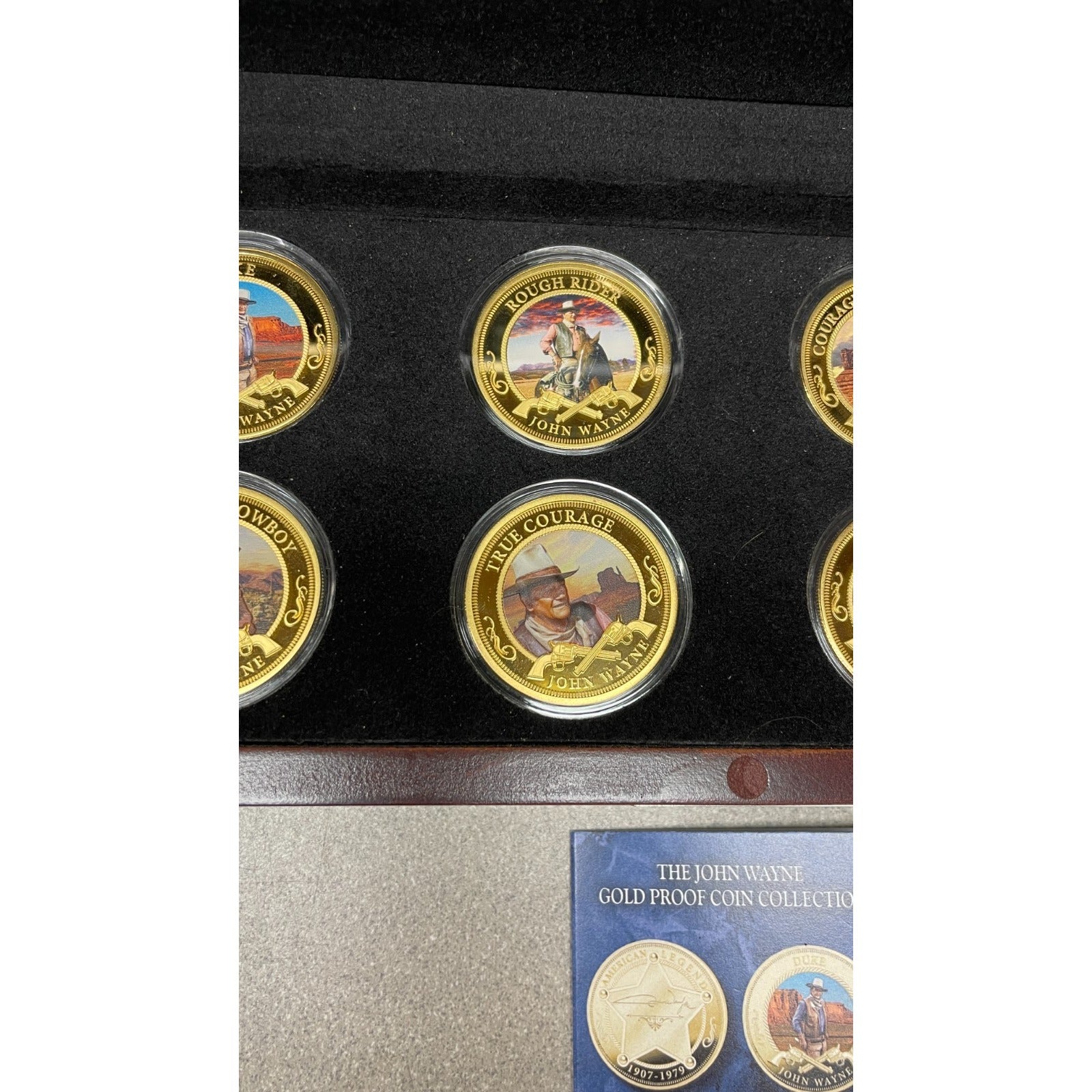 Bradford Exchange John Wayne Commemorative Coins and Collection Case closeup of coins in case rough riders, true courage