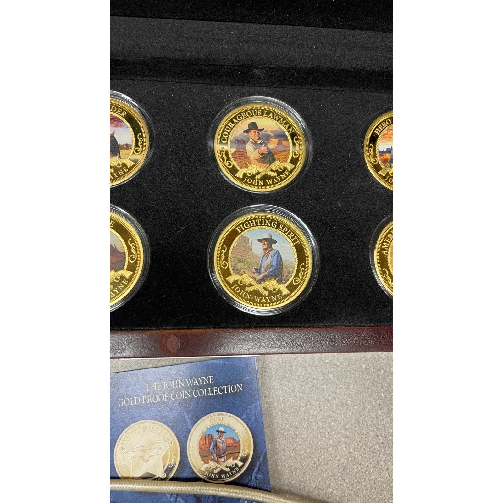 Bradford Exchange John Wayne Commemorative Coins and Collection Case closeup of coins in case, courageous lawman and fighting spirit