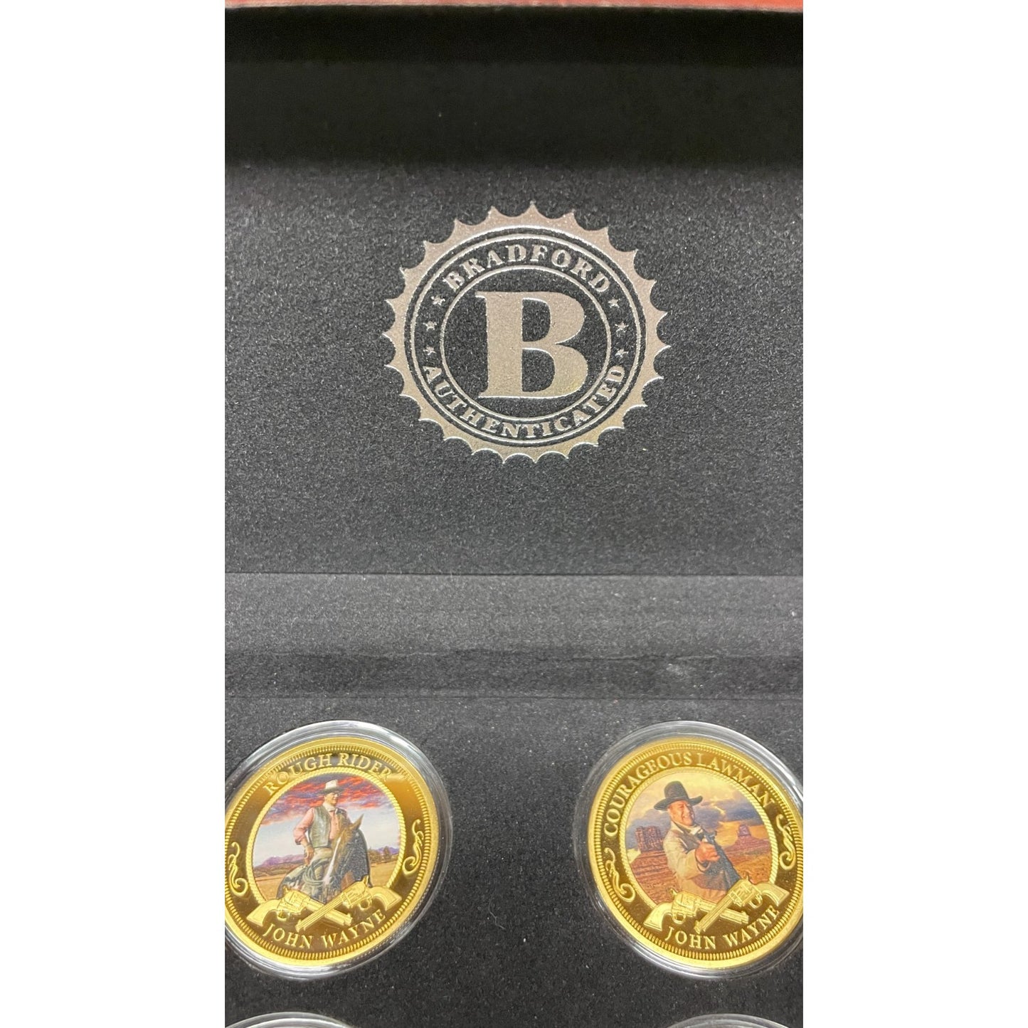 Bradford Exchange John Wayne Commemorative Coins and Collection Case closeup of logo and two coins