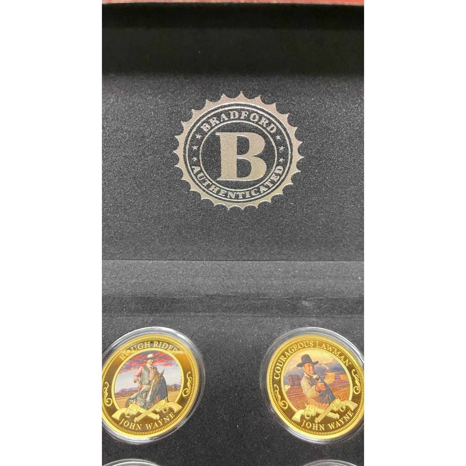 Bradford Exchange John Wayne Commemorative Coins and Collection Case closeup of logo and two coins