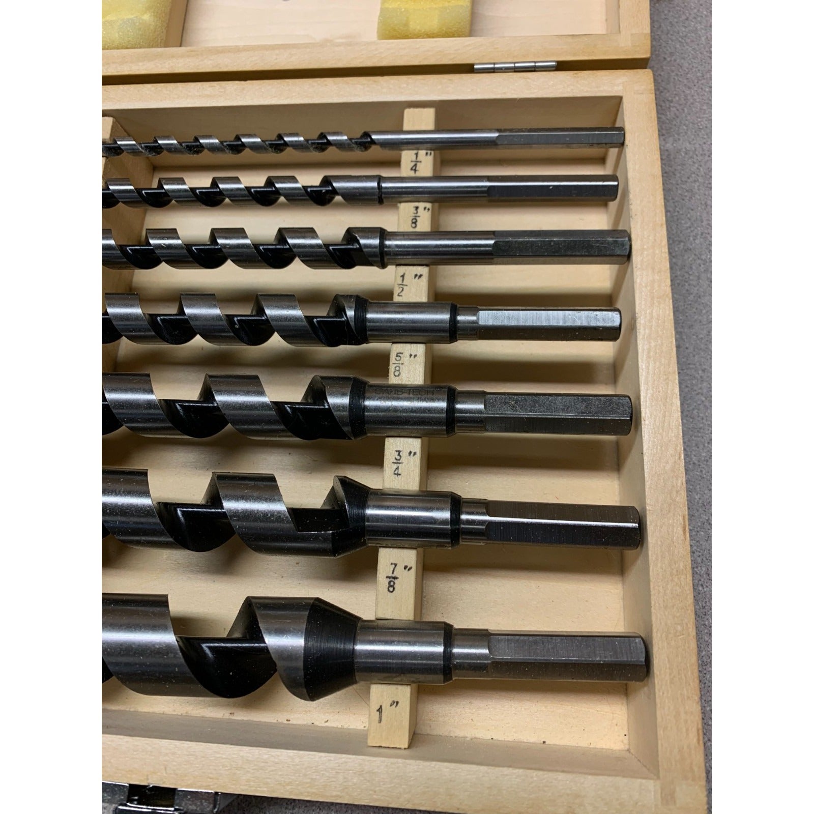 7 Piece Auger Bit Set Carb-Tech - Includes Bit sizes 1/4", 3/8", 1/2", 5/8", 3/4", 7/8", 1" closeup of tops of drill bits in case