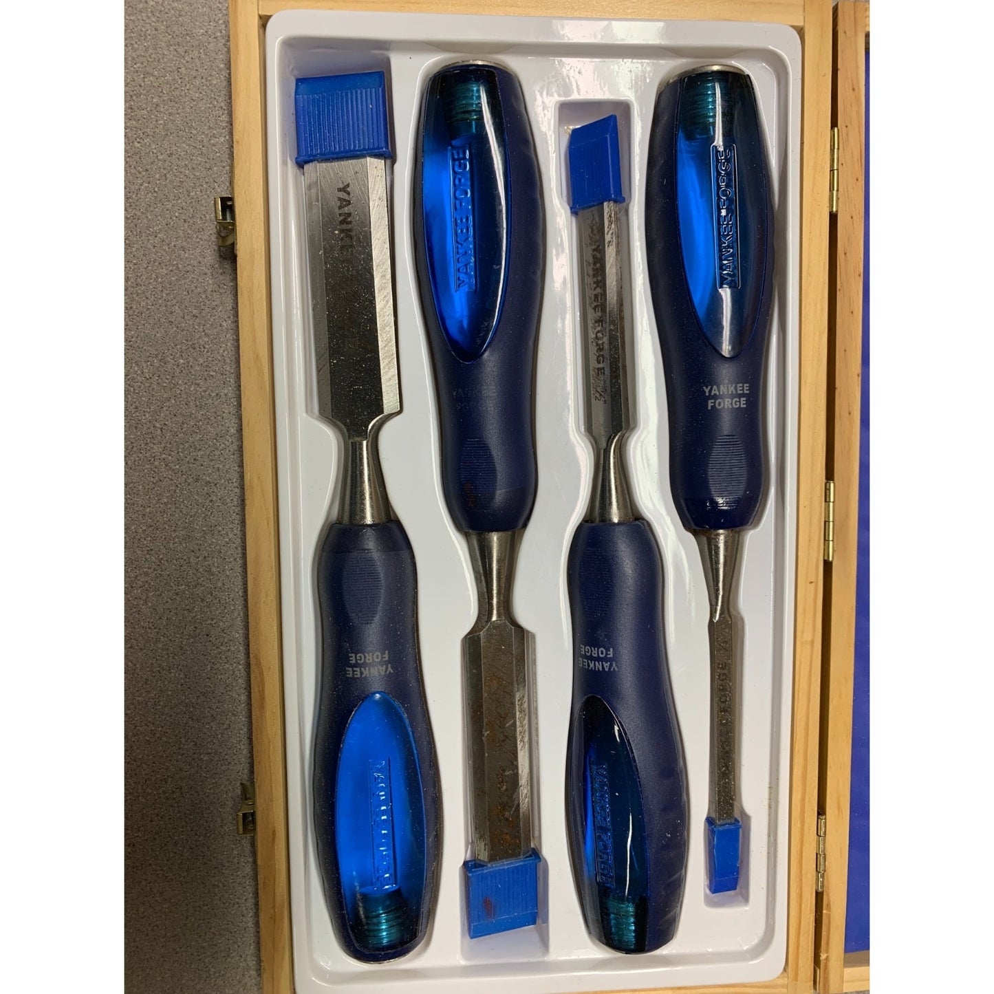 4pc Wood Chisel Set Yankee Forge - Includes sizes 1/4", 1/2", 3/4", 1"
 closeup of chisels in box