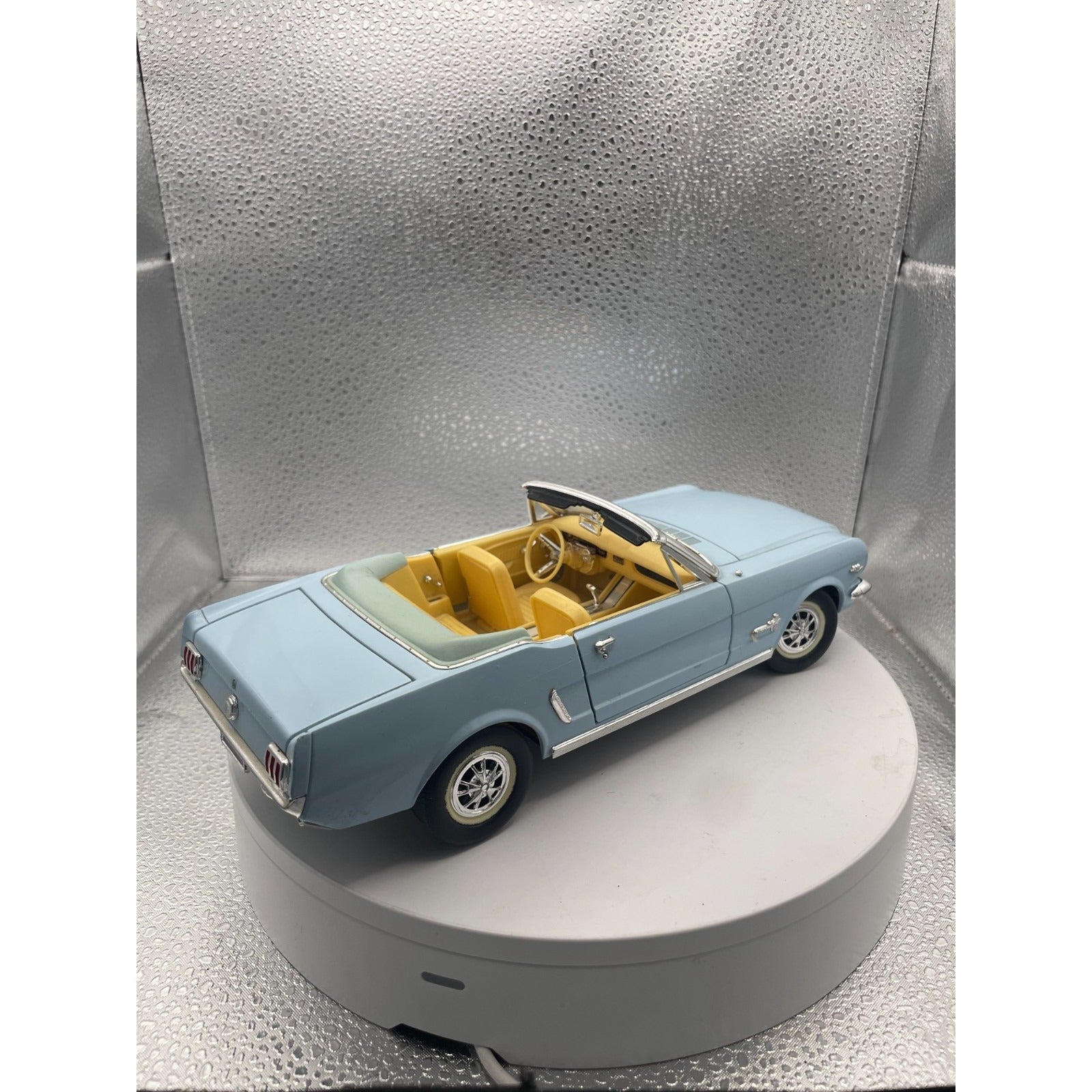MIRA 1965 Ford Mustang Light Blue Convertible Die Cast, Scale: 1/18 back end/passenger side view
