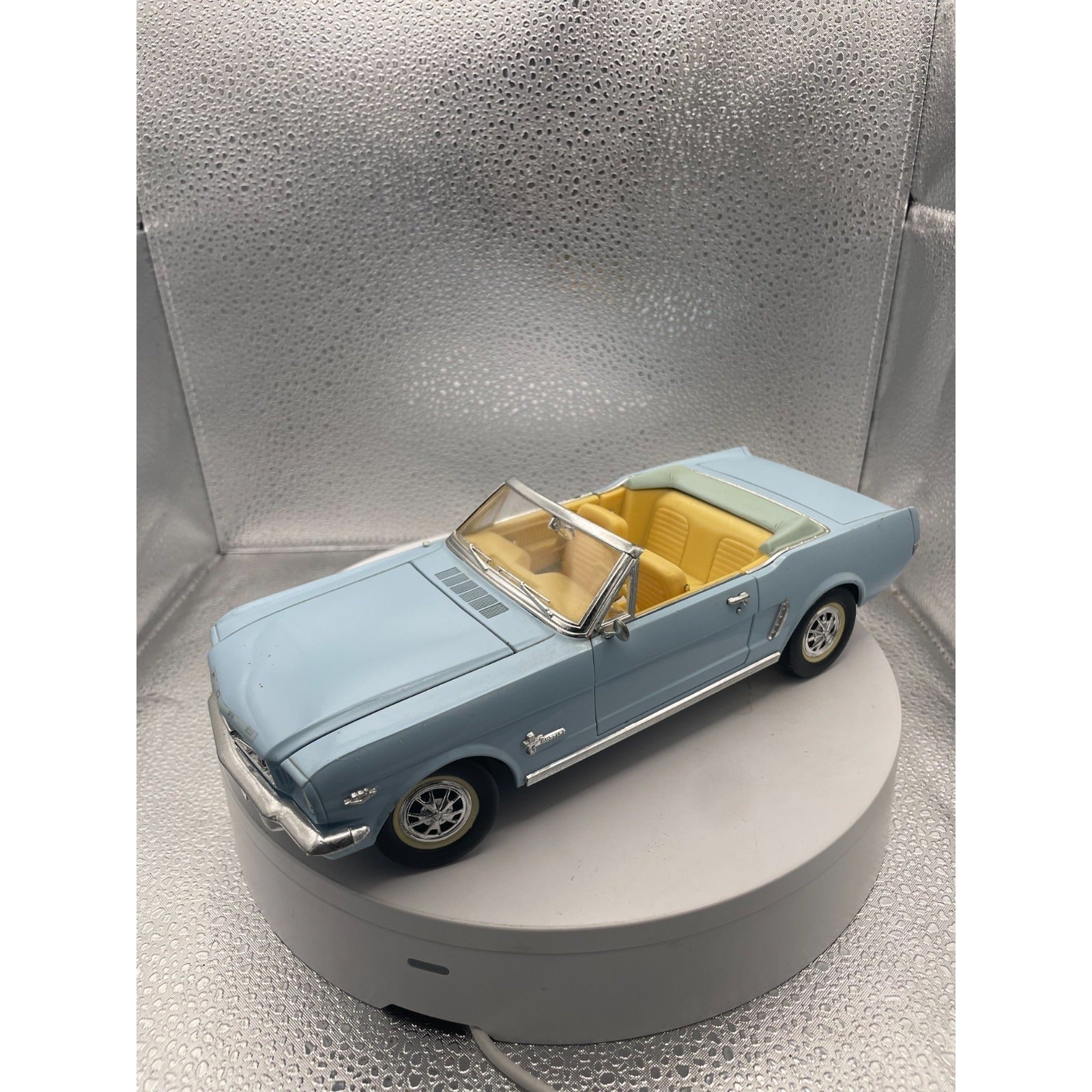 MIRA 1965 Ford Mustang Light Blue Convertible Die Cast, Scale: 1/18 front end/drivers side view