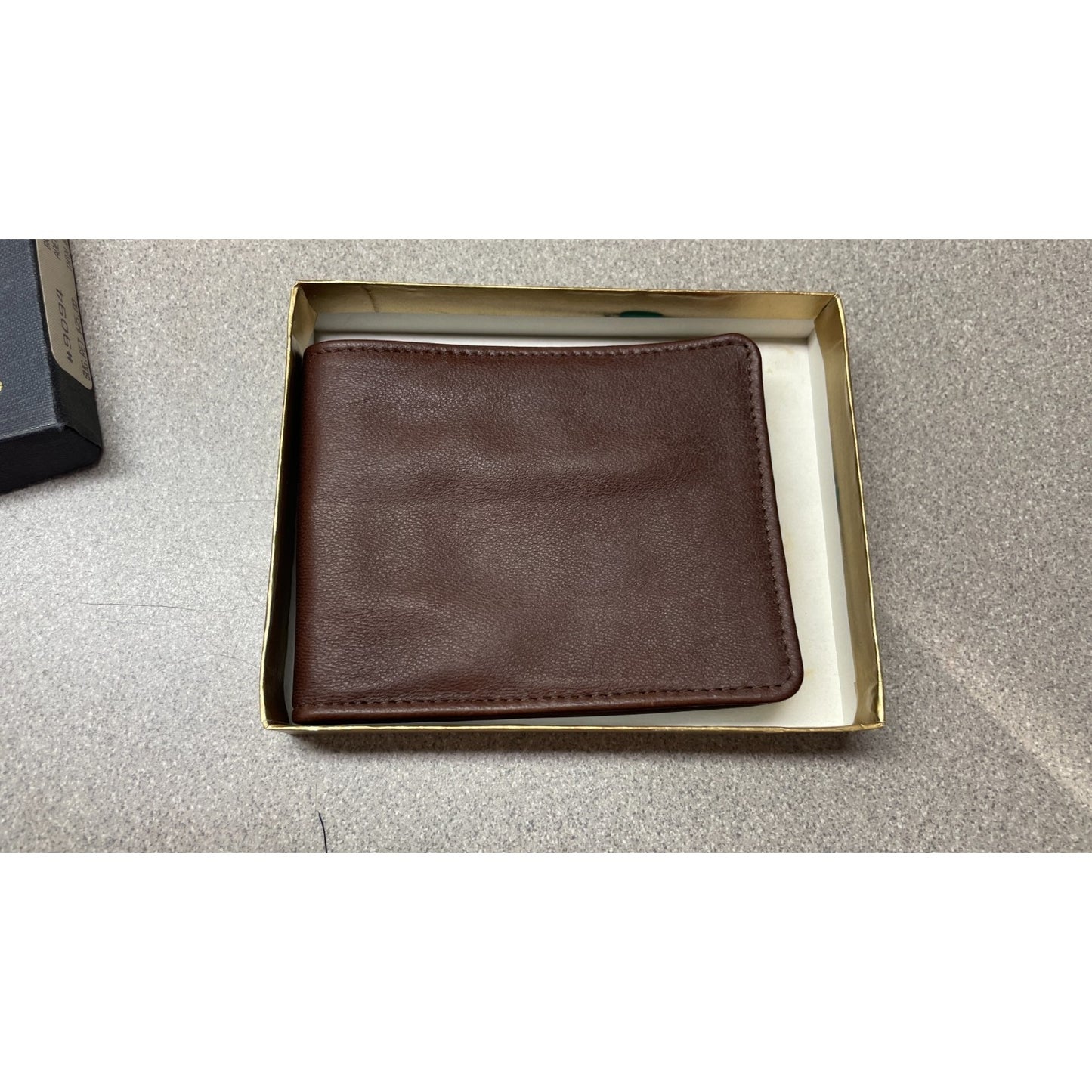 Stanley of England Brown Adelaide Lamb Leather Wallet front view of folded wallet in box