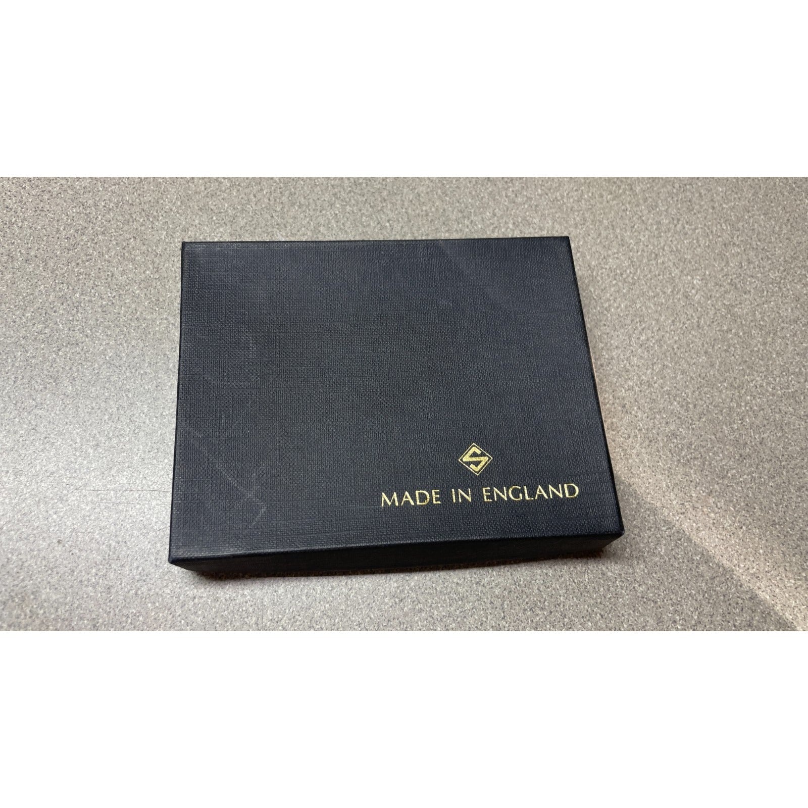 Stanley of England Brown Adelaide Lamb Leather Wallet front of box with logo and made in England stamp