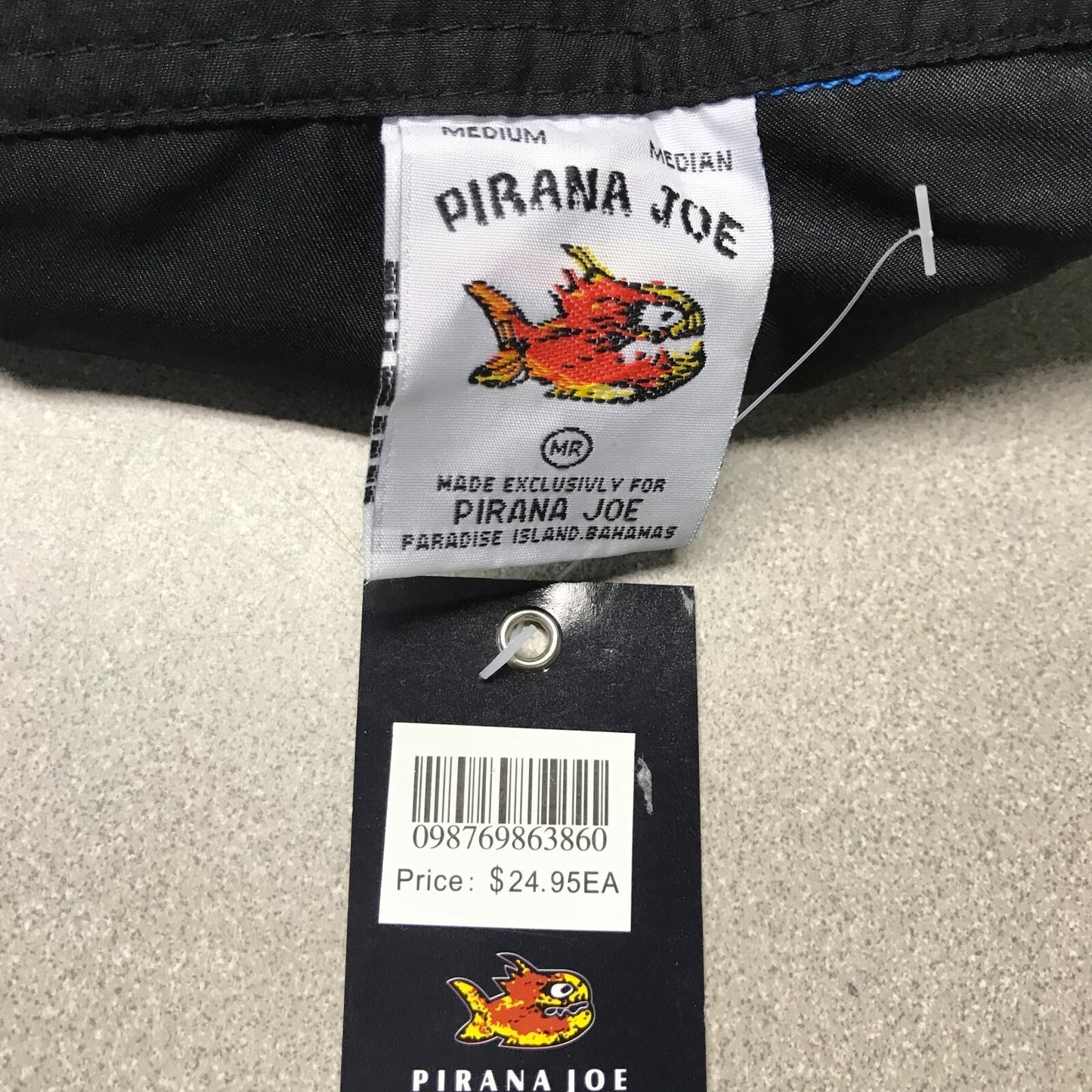 Pirana Joe Black Beach Shorts Medium tag closeup