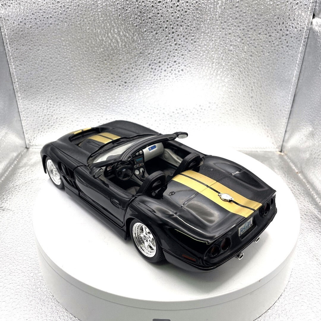 Maisto 1999 Shelby Series 1 Black and Gold Die Cast, 1/18 Scale driver's side/rear view