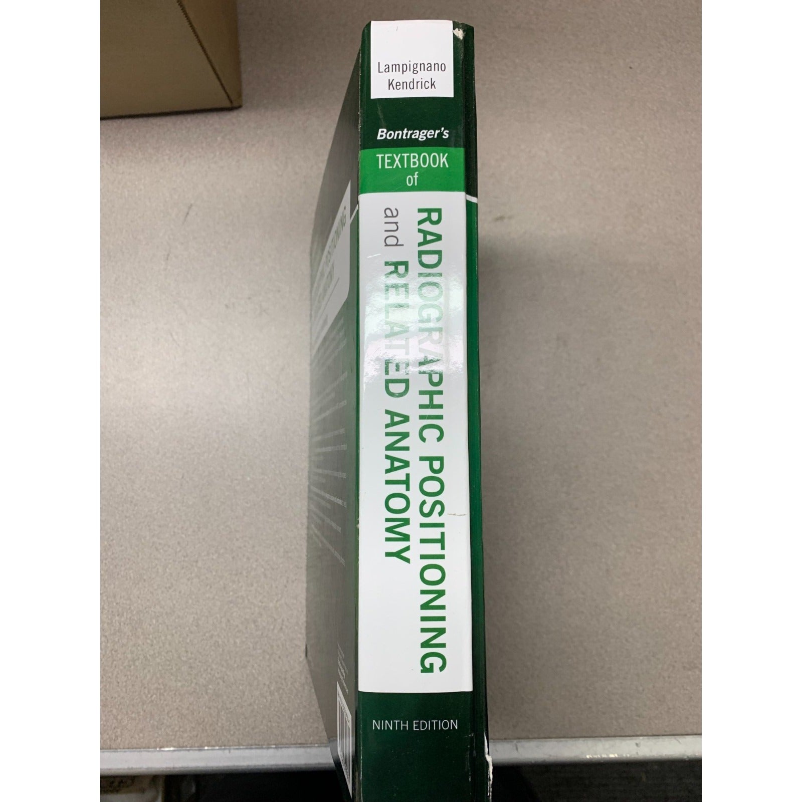 Radiographic Positioning and Related Anatomy 9th Edition J. Lampignano and L. Kendrick - Used Textbook book spine