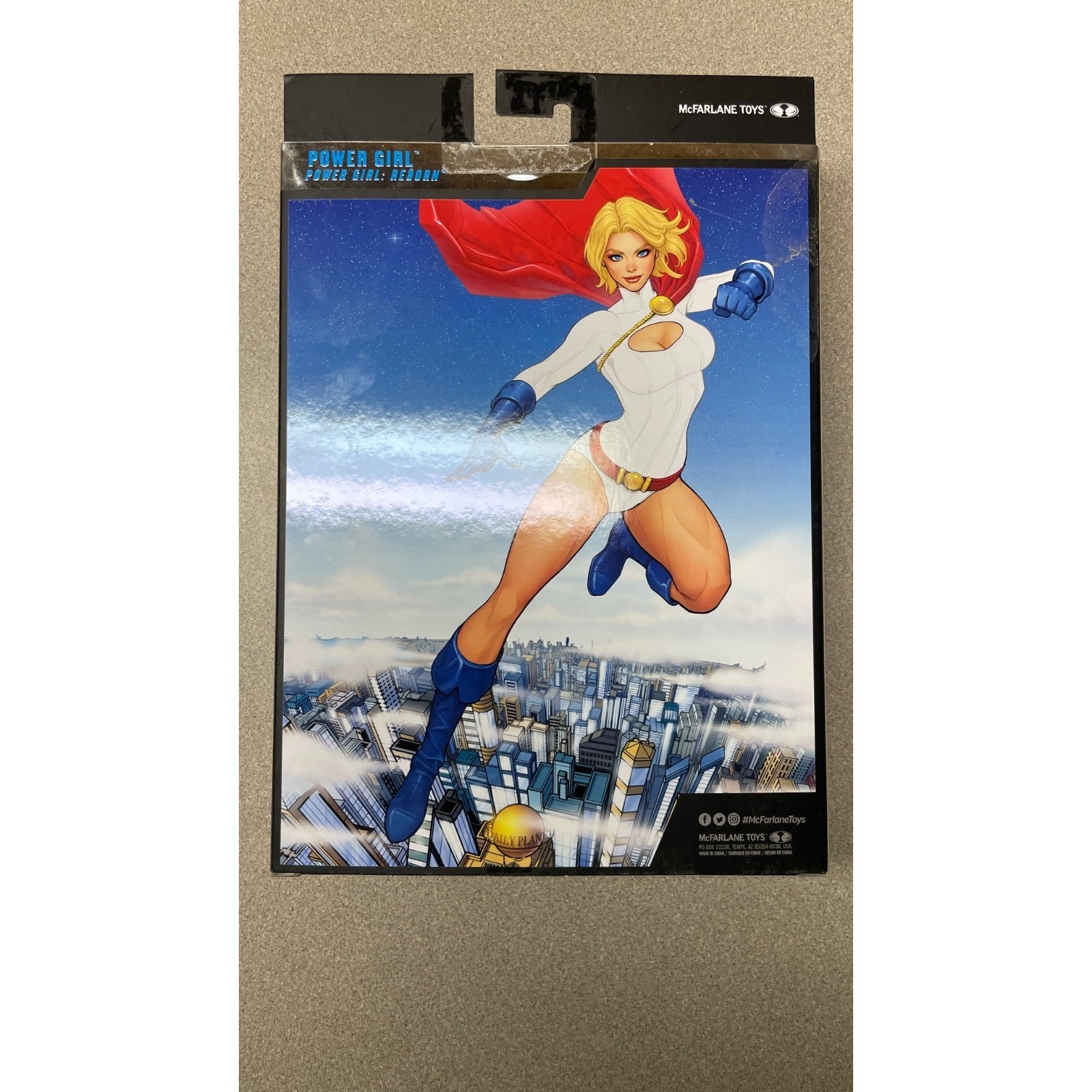 DC Multiverse Power Girl #31 McFarlane Collector Edition back of package showing action figure cartoon