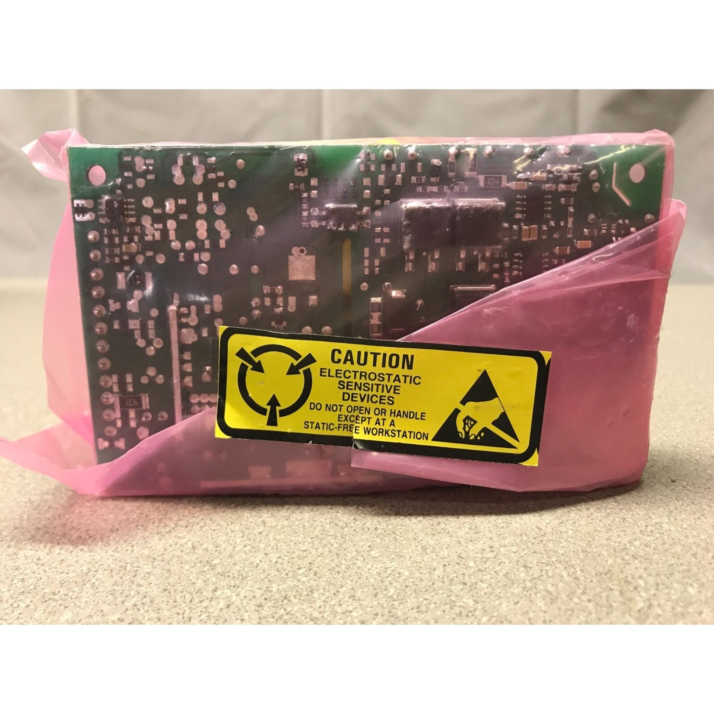 EOS Model LFVLT110-1302 100-240V back side of power supply in plastic bag with Caution seal label