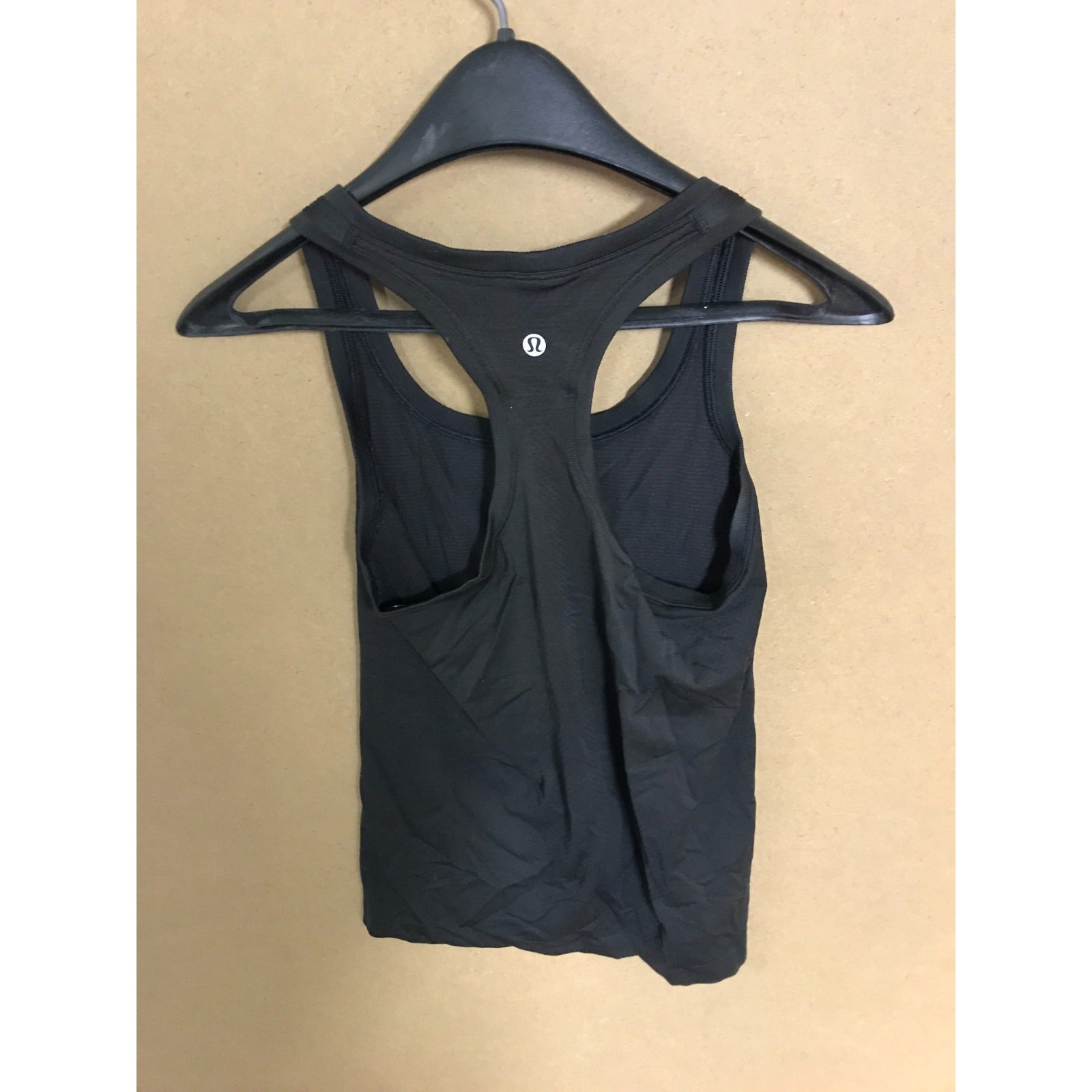 Lululemon Black Athletic Racerback Sleeveless Tank-top back of top on hanger show logo