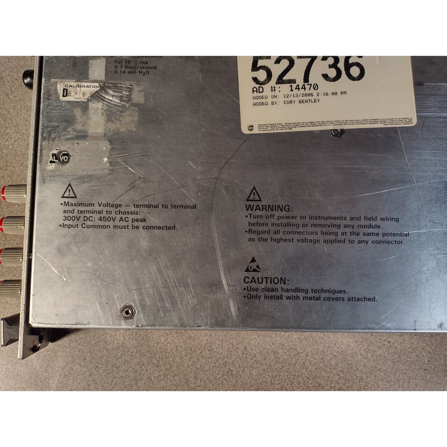 HP E1411B 75000 SERIES 5-1/2-DIGIT MULTIMETER top of unit item warnings closeup