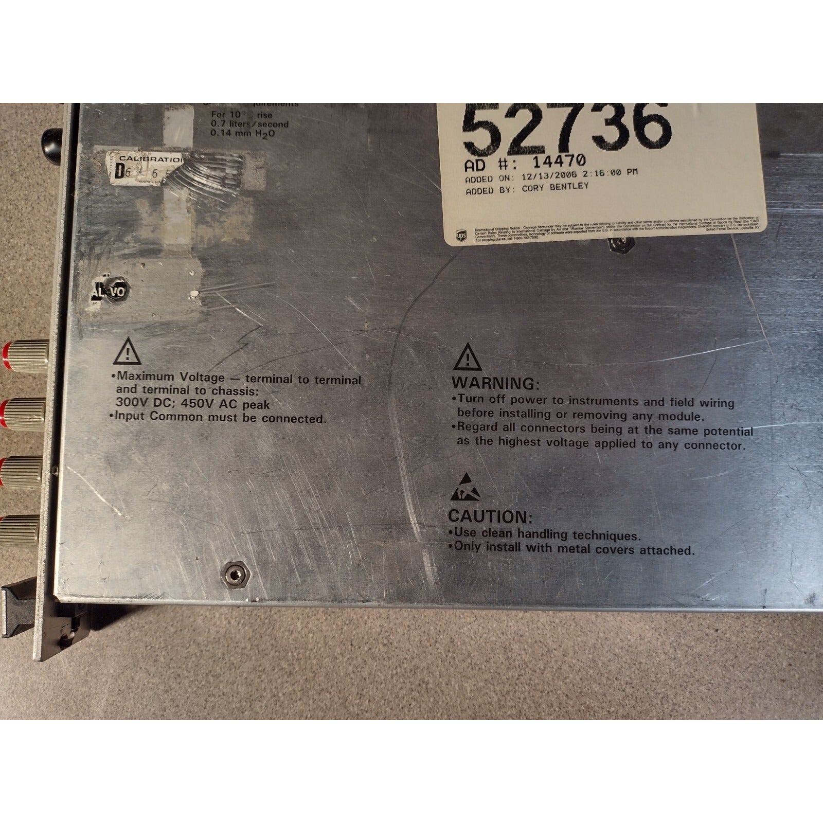 HP E1411B 75000 SERIES 5-1/2-DIGIT MULTIMETER top of unit item warnings closeup