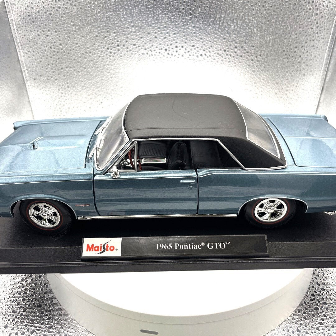 Maisto 1965 Pontiac GTO Blue Die Cast with Base, Scale: 1/18 driver's side view